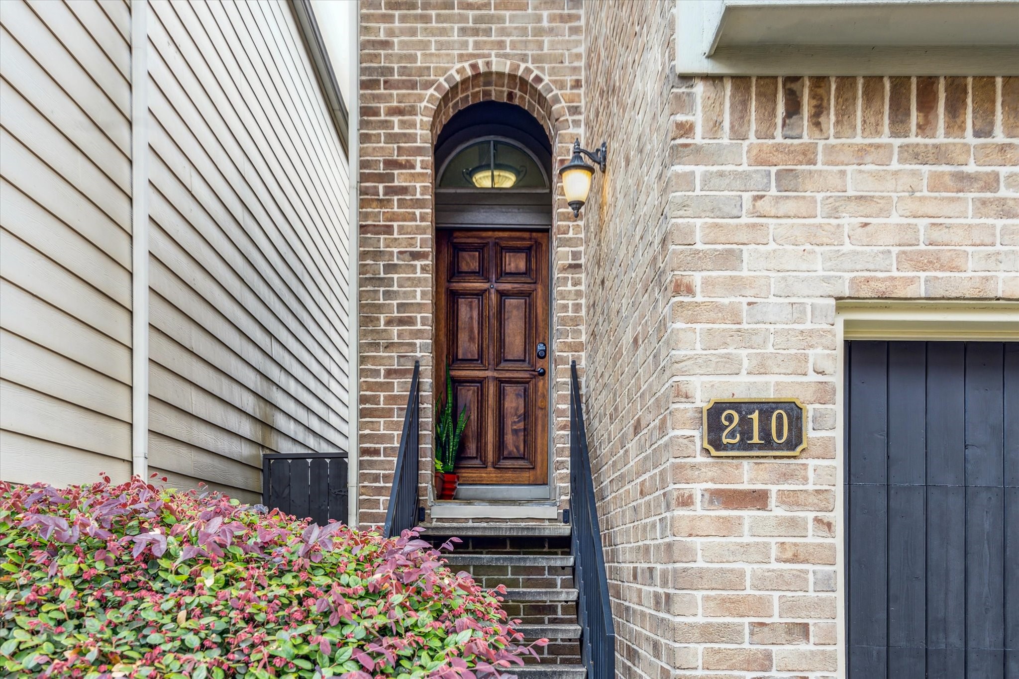 210 Grove Street Houston, TX 77020 - Photo 2 of 28 a front view of a house with a garden