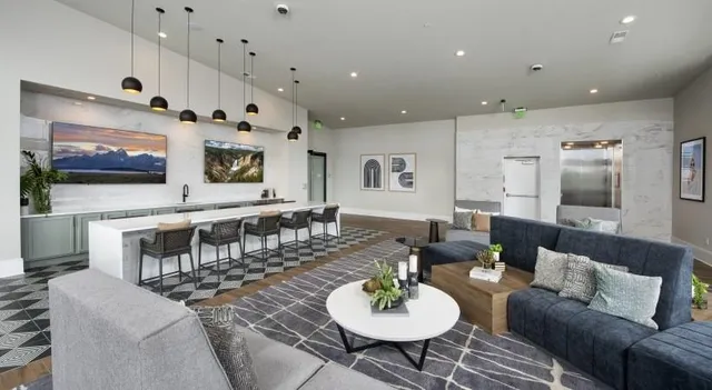 a large kitchen with a table and chairs