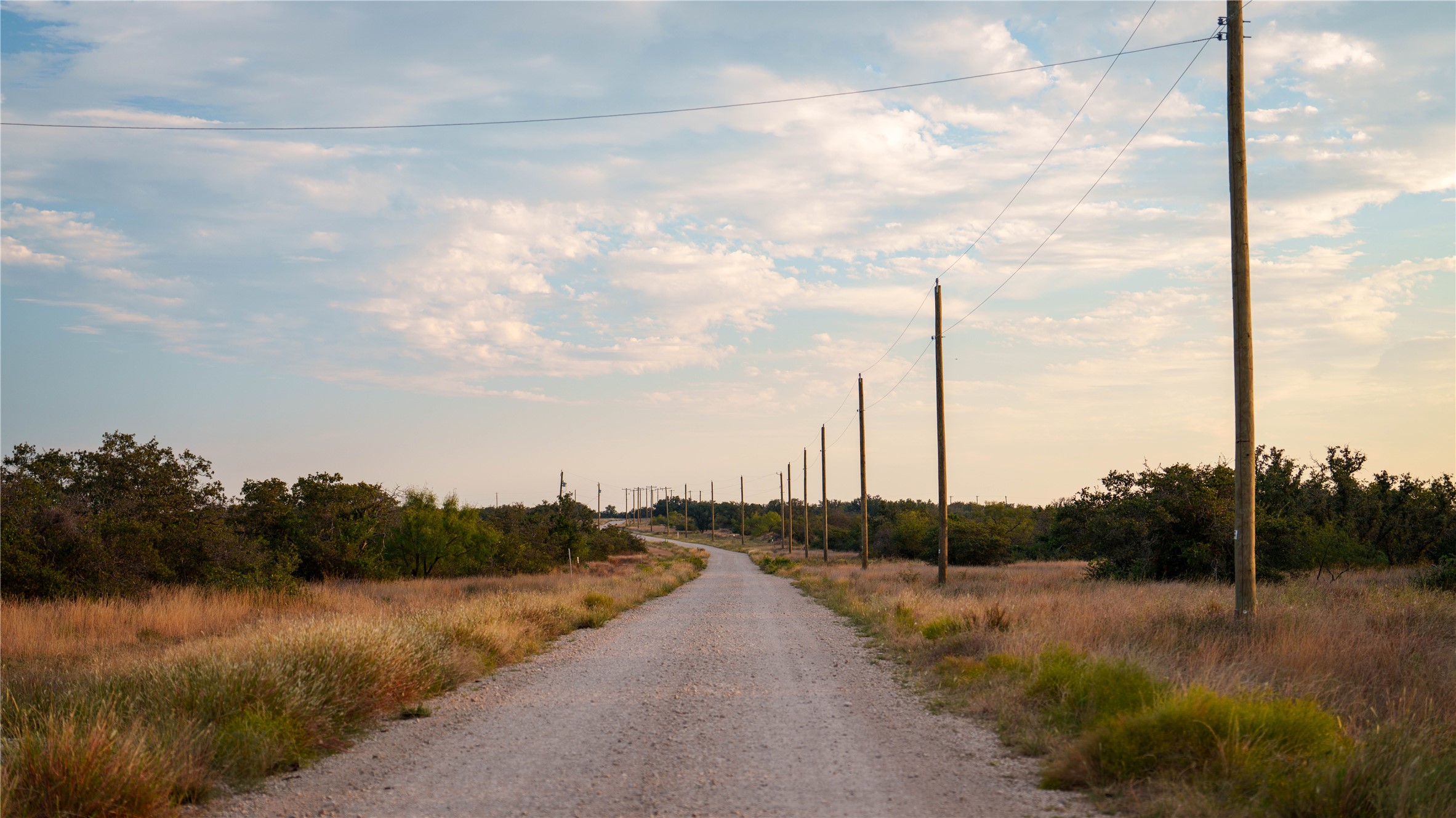 8500 Buck Ridge Drive Brady, TX 76825 - Photo 23 of 32 View of dirt / gravel road featuring a view of rural / pastoral area