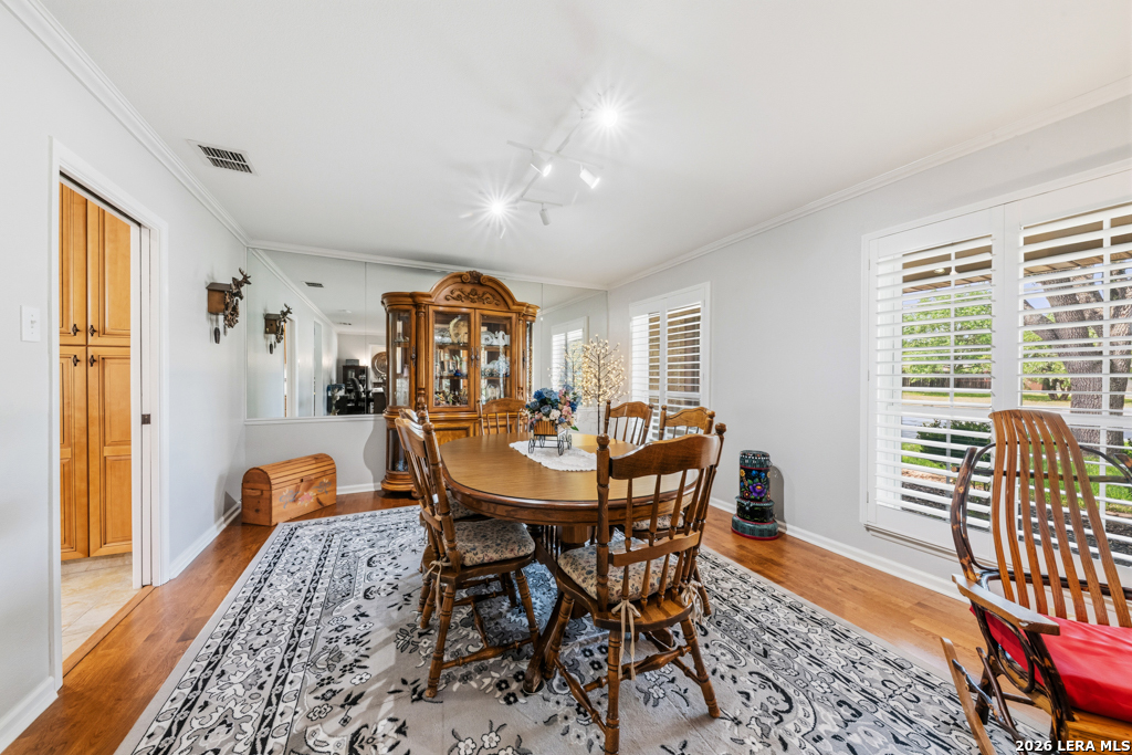 6022 Winding Ridge Drive Windcrest, TX 78239 - Photo 15 of 31 a view of a dining room with furniture and a window
