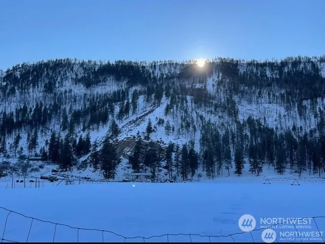 a view of an ocean from a mountain