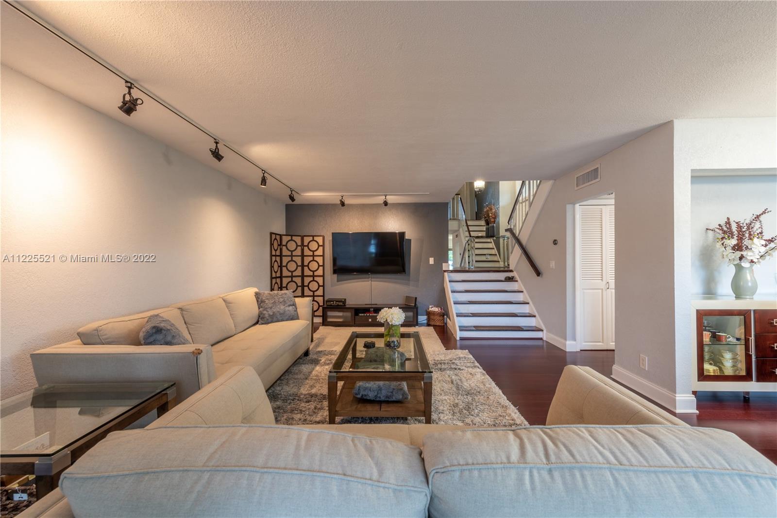 3453 Spring Bluff Place, Unit 12 Lauderhill, FL 33319 - Photo 1 of 20 a living room with furniture and a couch
