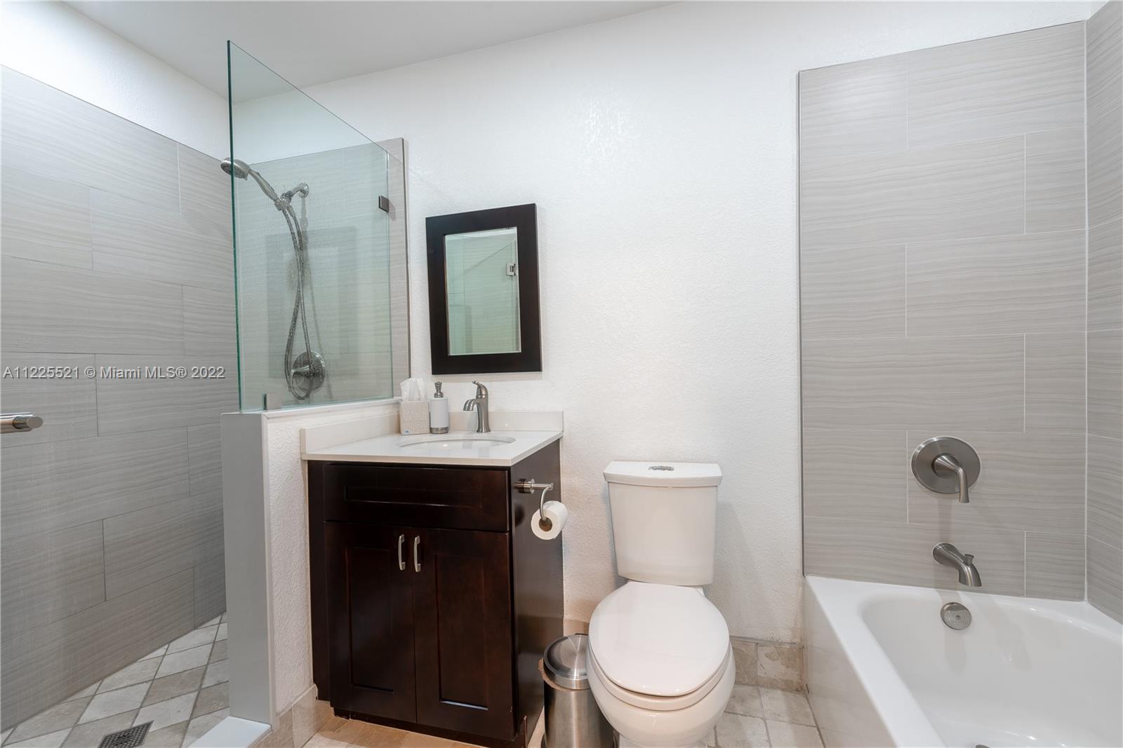 3453 Spring Bluff Place, Unit 12 Lauderhill, FL 33319 - Photo 12 of 20 a bathroom with a sink a toilet and shower