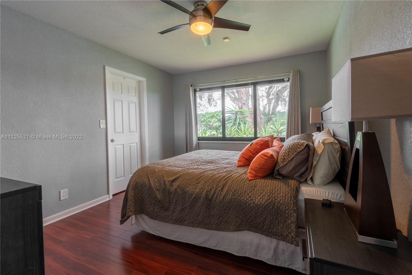 3453 Spring Bluff Place, Unit 12 Lauderhill, FL 33319 - Photo 13 of 20 a bedroom with a bed and window