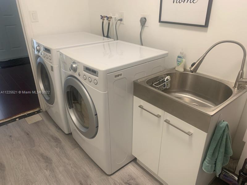 3453 Spring Bluff Place, Unit 12 Lauderhill, FL 33319 - Photo 18 of 20 a utility room with dryer and washer