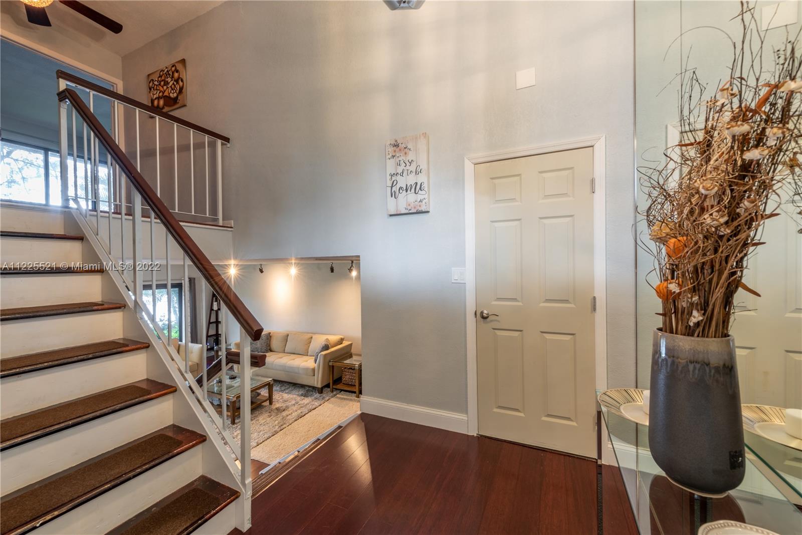 3453 Spring Bluff Place, Unit 12 Lauderhill, FL 33319 - Photo 2 of 20 a view of entryway with wooden floor and stairs