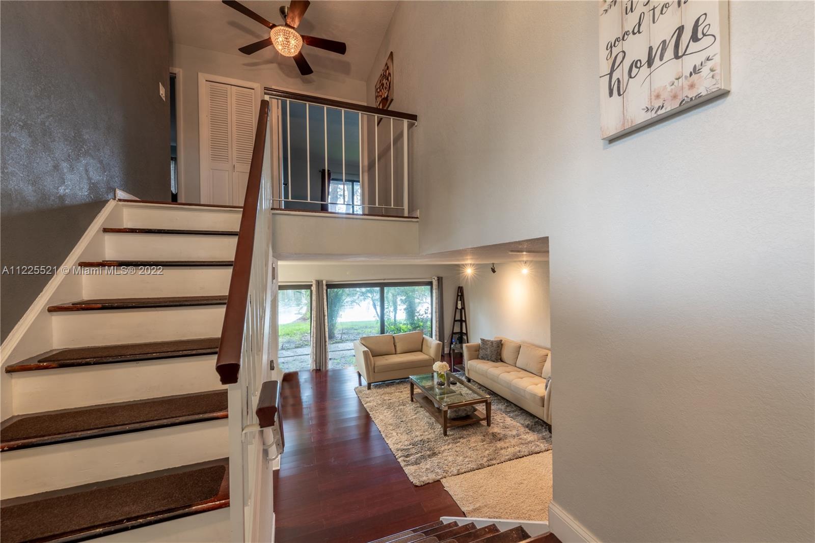 3453 Spring Bluff Place, Unit 12 Lauderhill, FL 33319 - Photo 3 of 20 a view of entryway and hall with wooden floor