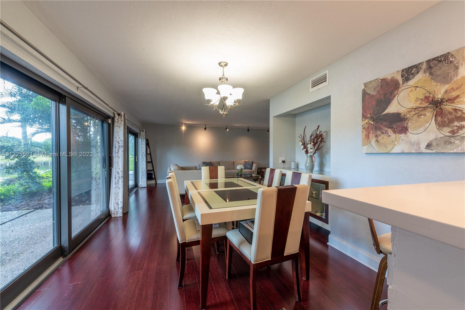 3453 Spring Bluff Place, Unit 12 Lauderhill, FL 33319 - Photo 5 of 20 a view of a dining room with furniture window and wooden floor