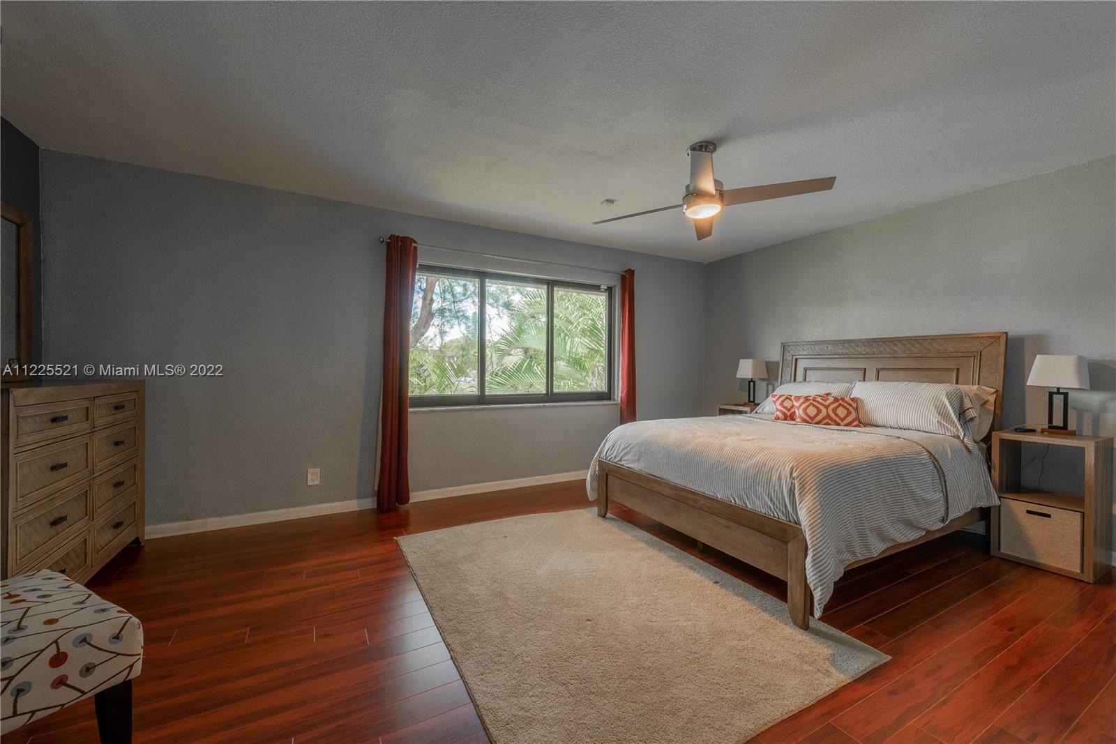 3453 Spring Bluff Place, Unit 12 Lauderhill, FL 33319 - Photo 10 of 20 a bedroom with a large bed and a window