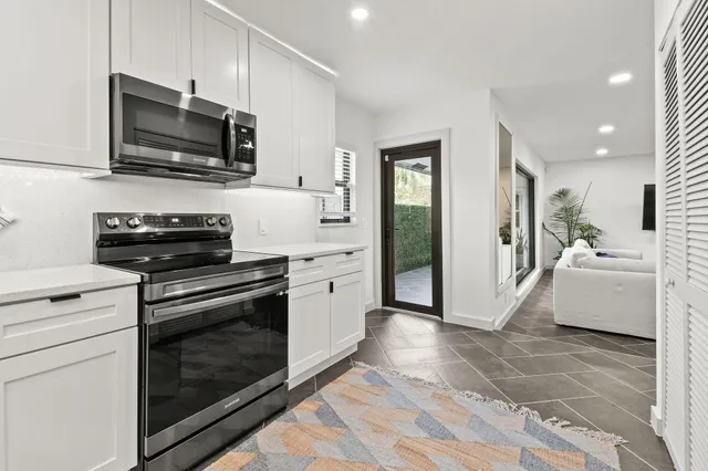 a kitchen with a stove and a microwave