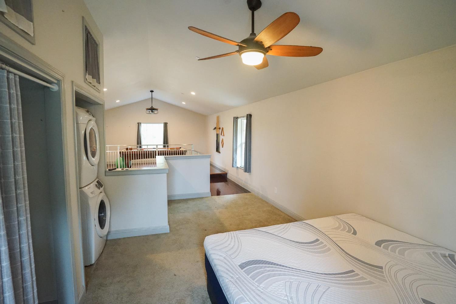 16375 Jesus Maria Road Mokelumne Hill, CA 95245 - Photo 20 of 39 a kitchen with a refrigerator a sink dishwasher with a dining table and chairs