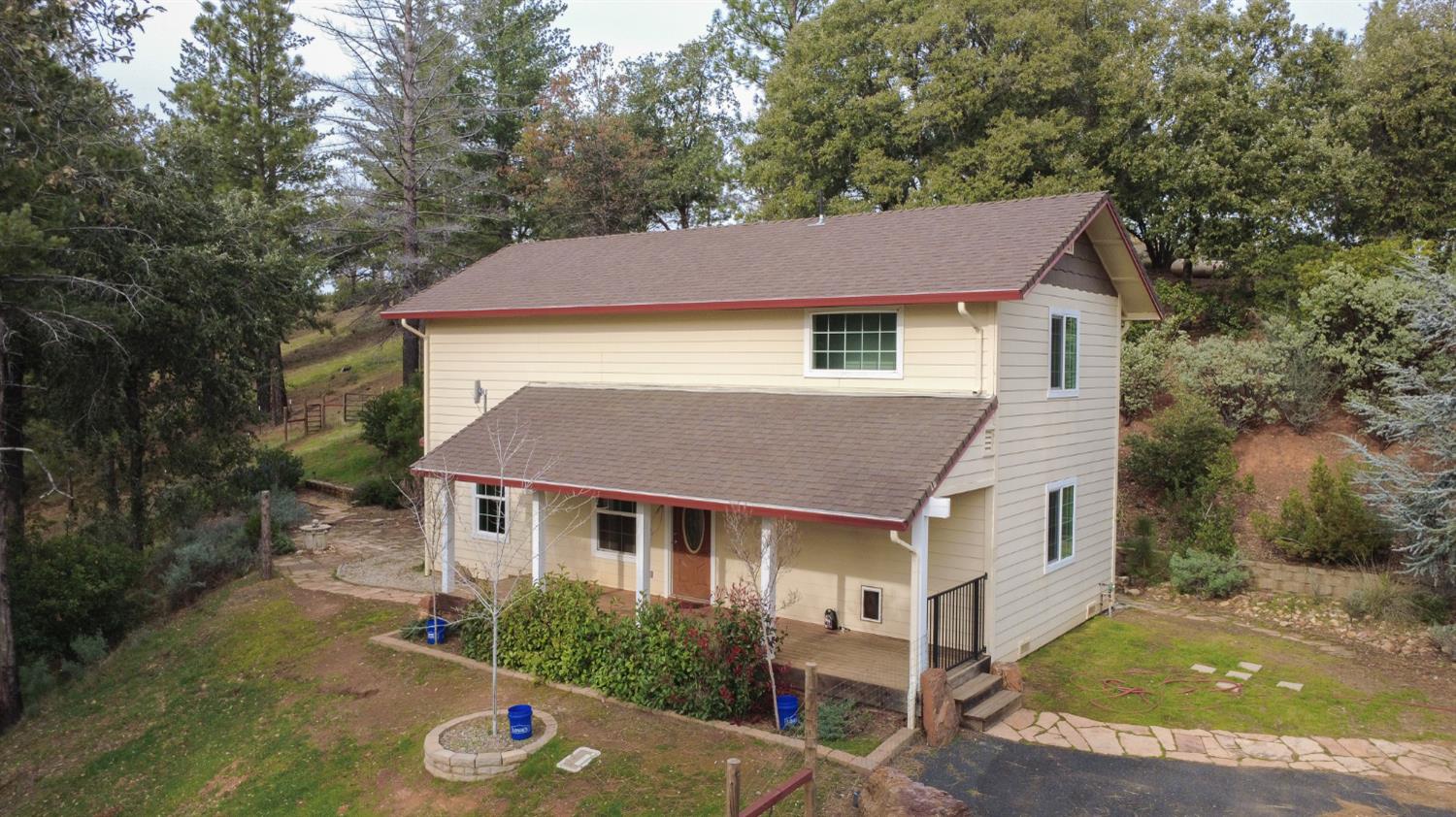 16375 Jesus Maria Road Mokelumne Hill, CA 95245 - Photo 2 of 39 a front view of a house with a yard
