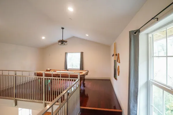 a view of a hallway with windows