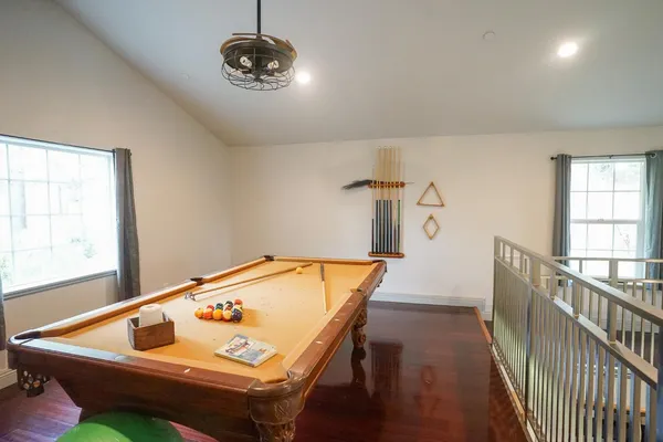 a view of a room with furniture and windows