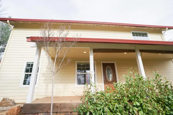 a front view of a house with a garage