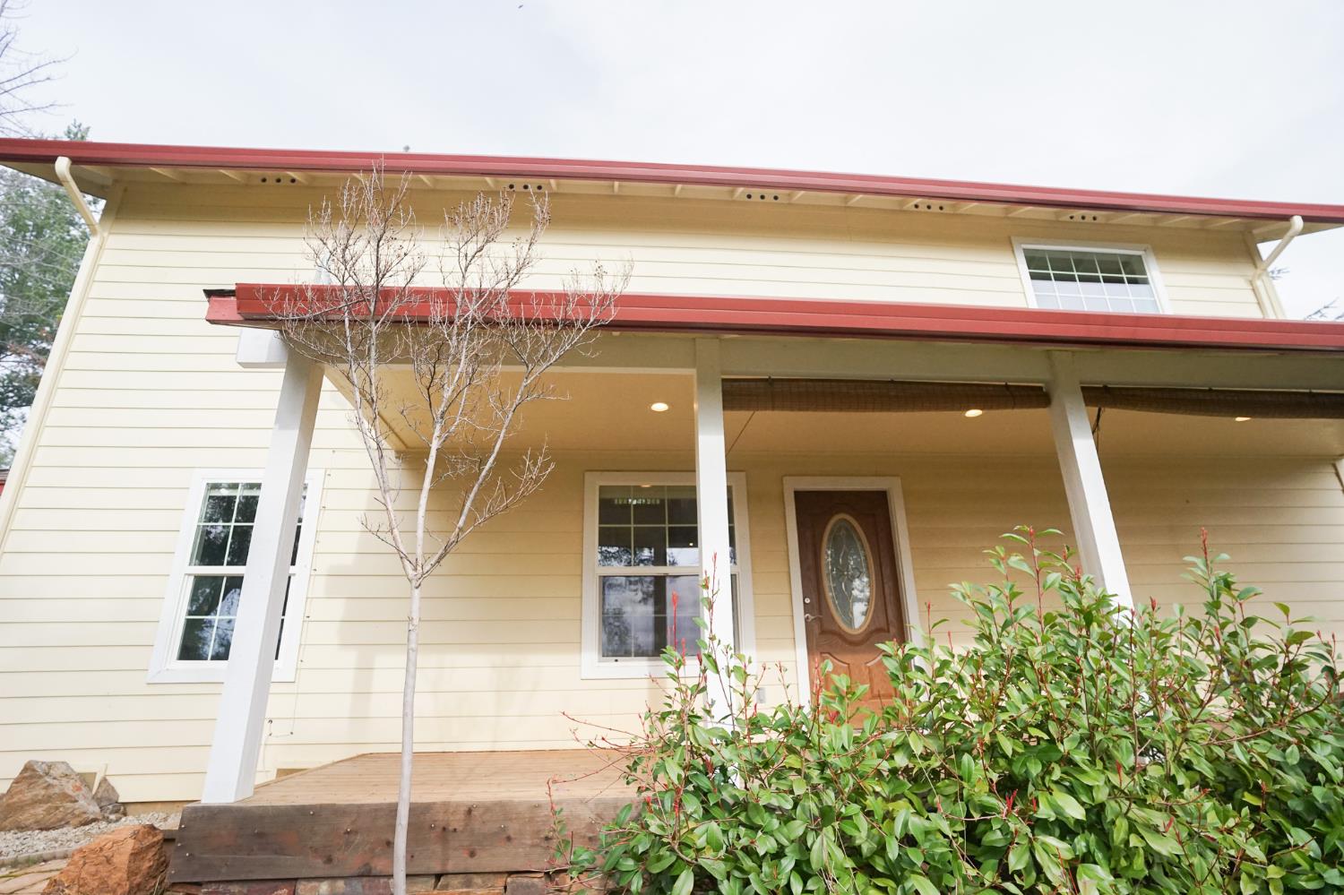 16375 Jesus Maria Road Mokelumne Hill, CA 95245 - Photo 4 of 39 a front view of a house with a garage