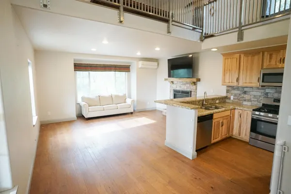 a kitchen with stove and cabinets