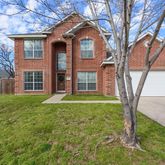 a front view of a house with yard