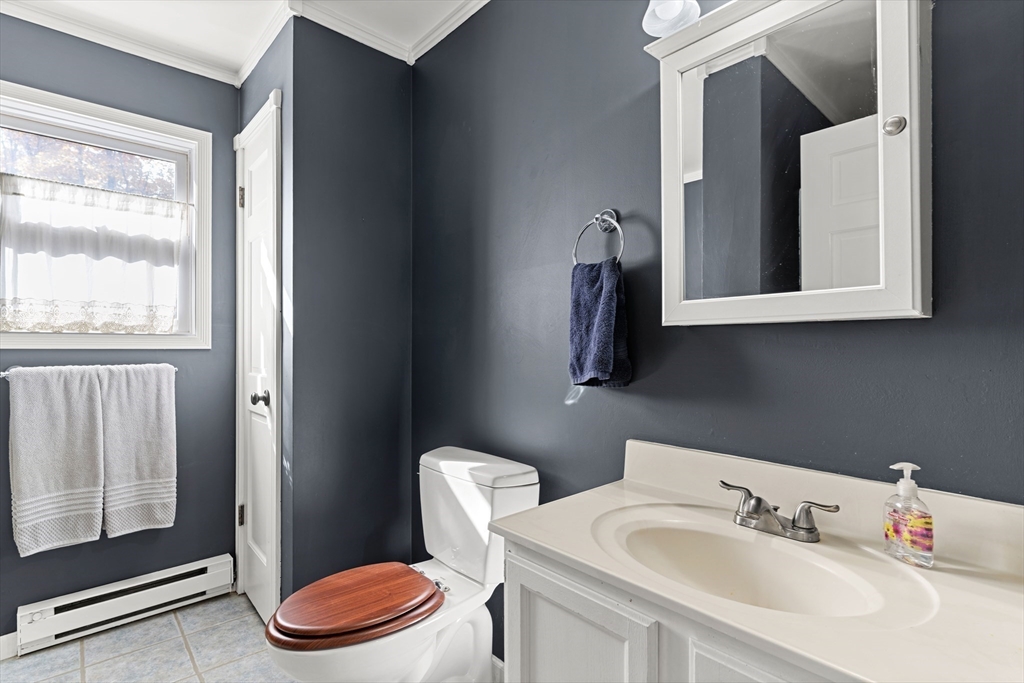 21 Hammond Street Rowley, MA 01969 - Photo 18 of 26 a bathroom with a toilet sink and mirror