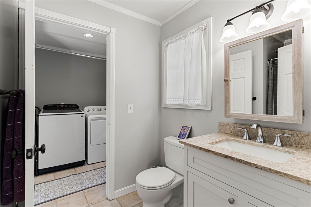 21 Hammond Street Rowley, MA 01969 - Photo 20 of 26 a bathroom with a granite countertop sink toilet and mirror