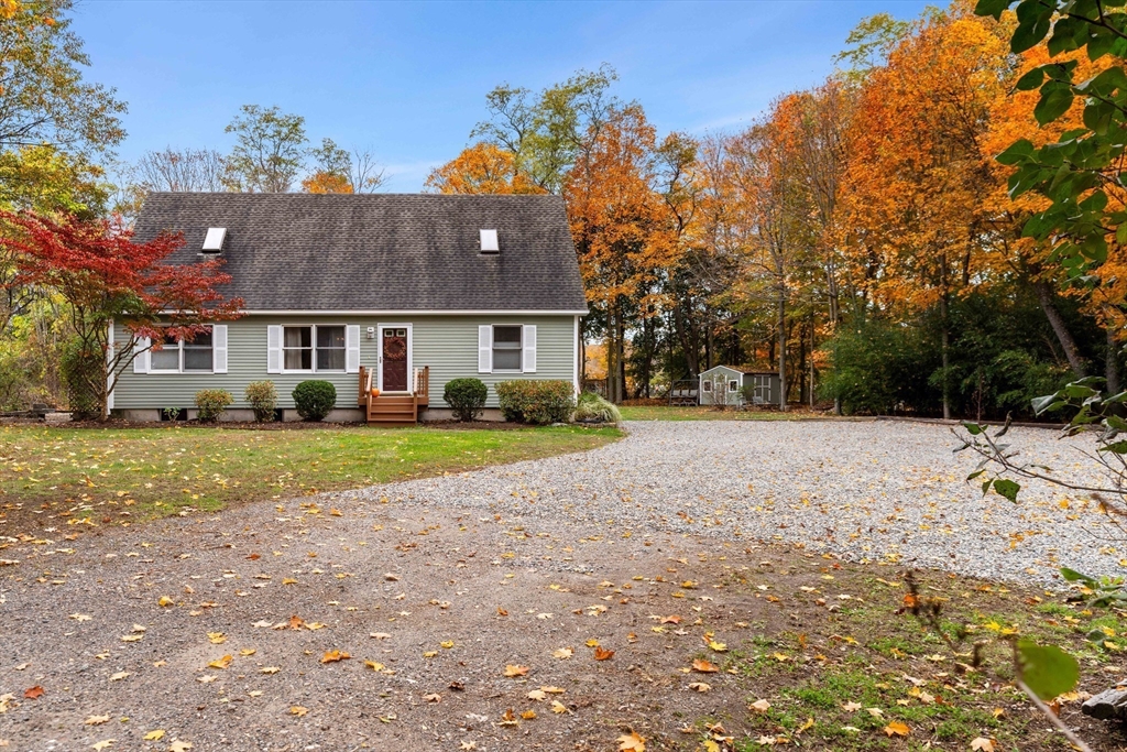 21 Hammond Street Rowley, MA 01969 - Photo 24 of 26 a view of house with yard and trees in the background