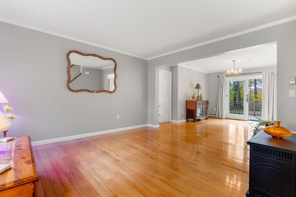 21 Hammond Street Rowley, MA 01969 - Photo 7 of 26 a view of an empty room with window and wooden floor