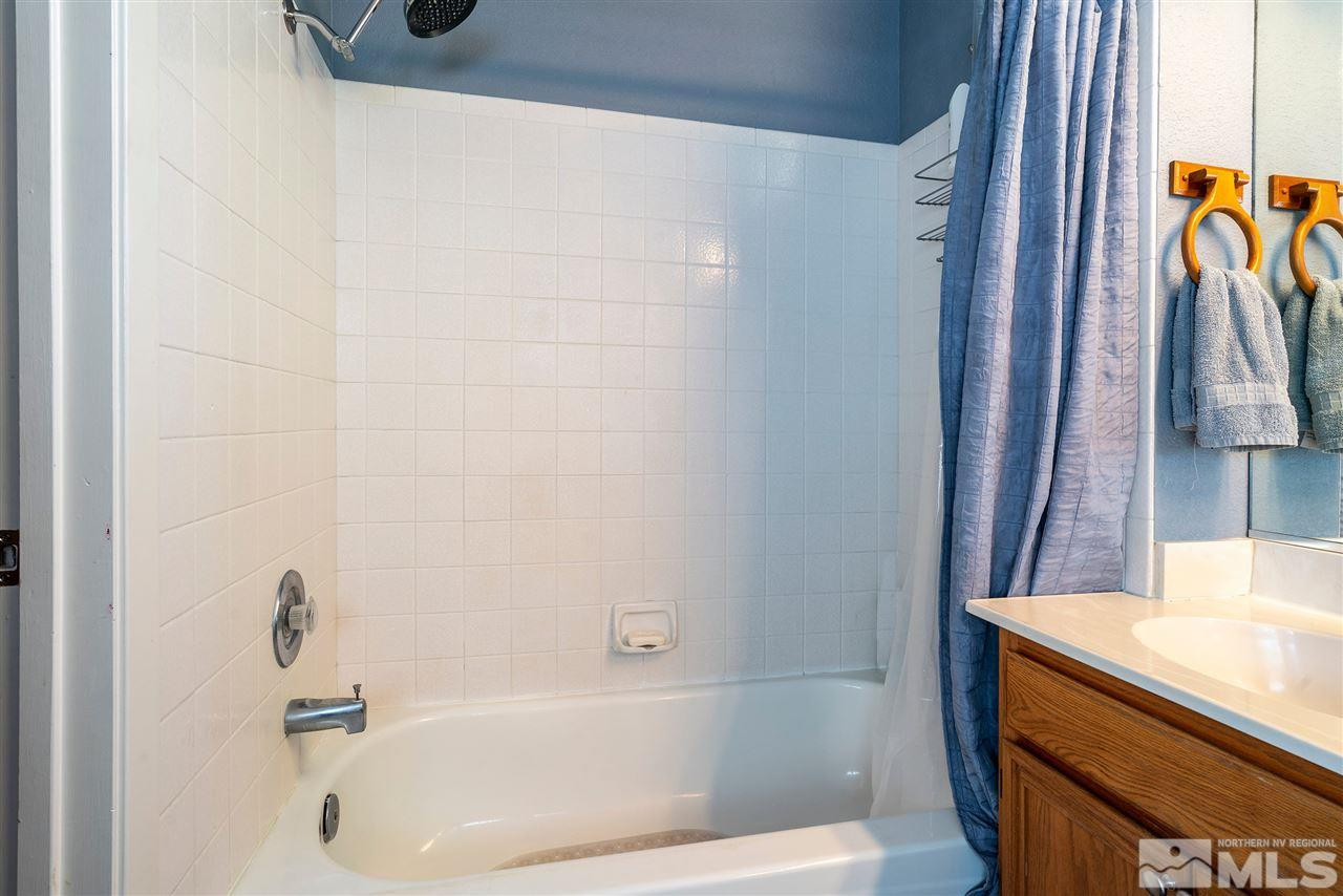 1030 Backer Way Reno, NV 89523 - Photo 15 of 25 a bathroom with a bathtub and a sink