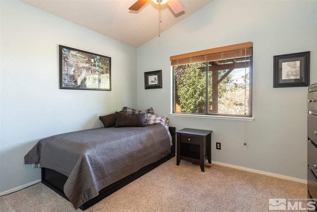 1030 Backer Way Reno, NV 89523 - Photo 16 of 25 a bedroom with a bed and a window