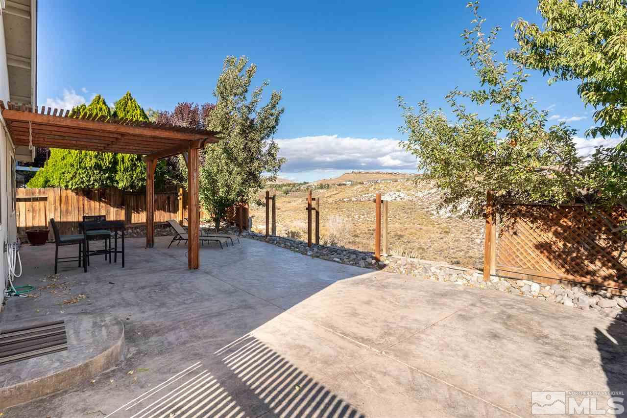 1030 Backer Way Reno, NV 89523 - Photo 21 of 25 a view of a backyard tables and chairs