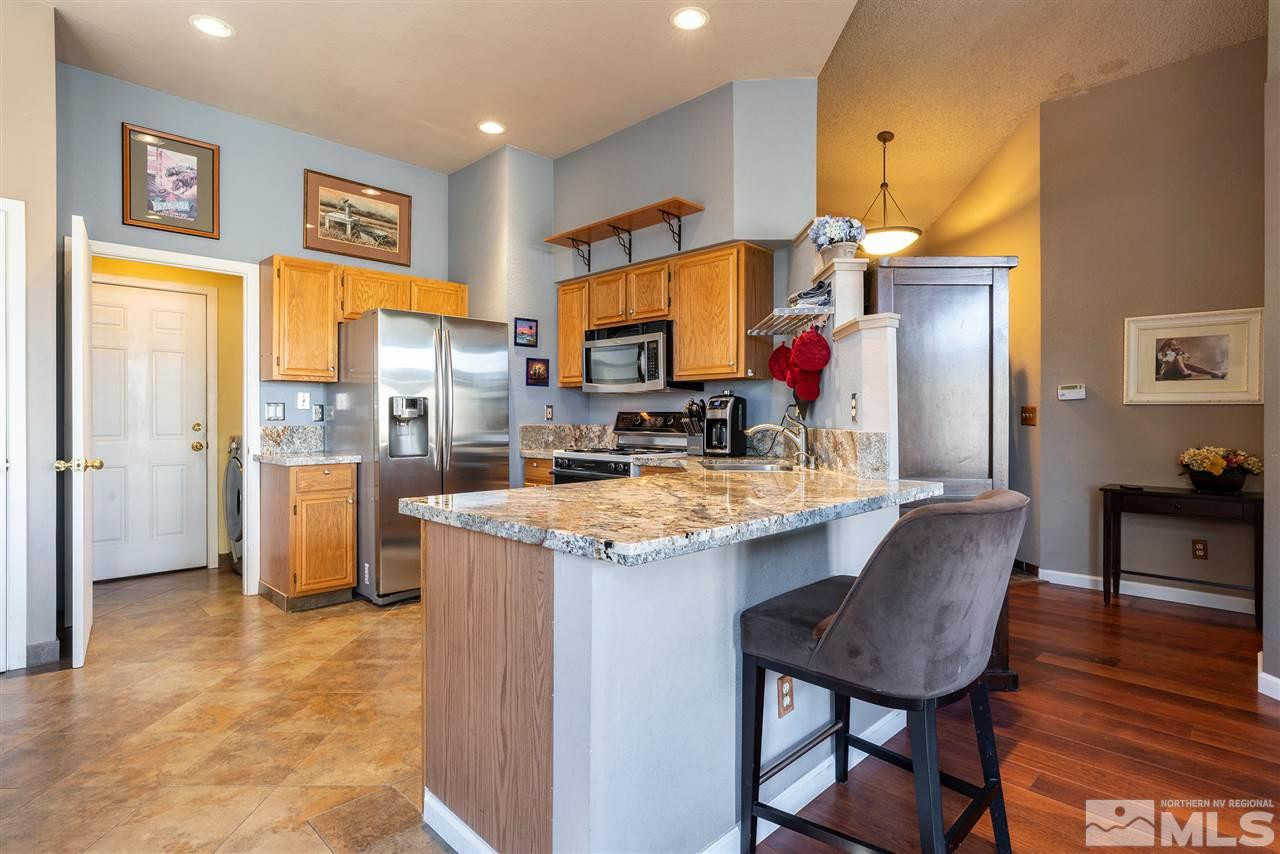 1030 Backer Way Reno, NV 89523 - Photo 8 of 25 a kitchen that has a table and chairs in it