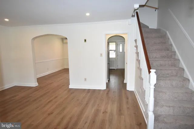 a view of entryway with wooden floor
