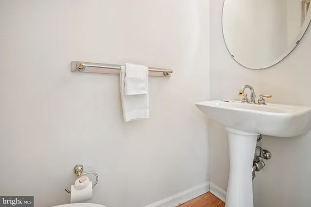 a bedroom with bed and a large window