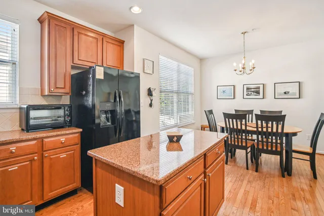 a dining table with chairs and window