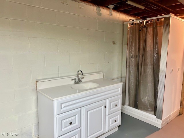 3422 Southern Road Richfield, OH 44286 - Photo 32 of 42 storage room with concrete flooring, vanity, and curtained shower
