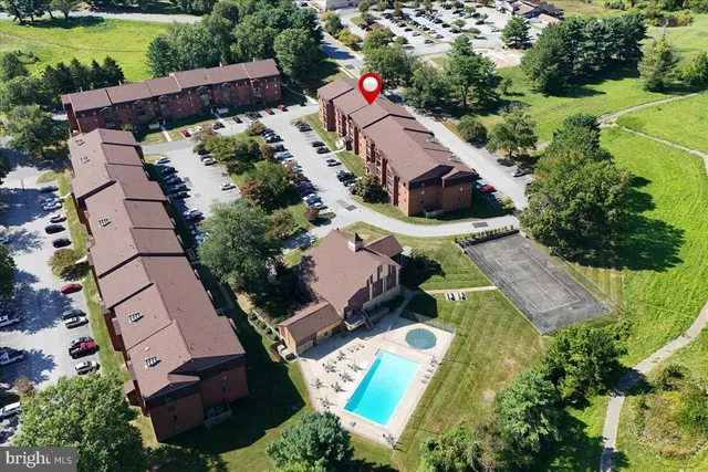 an aerial view of house with yard swimming pool and outdoor seating