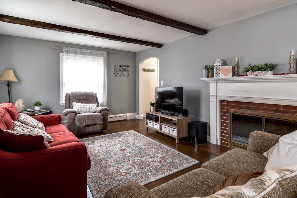 514 Edgell Road Framingham, MA 01701 - Photo 17 of 35 a living room with furniture and a fireplace