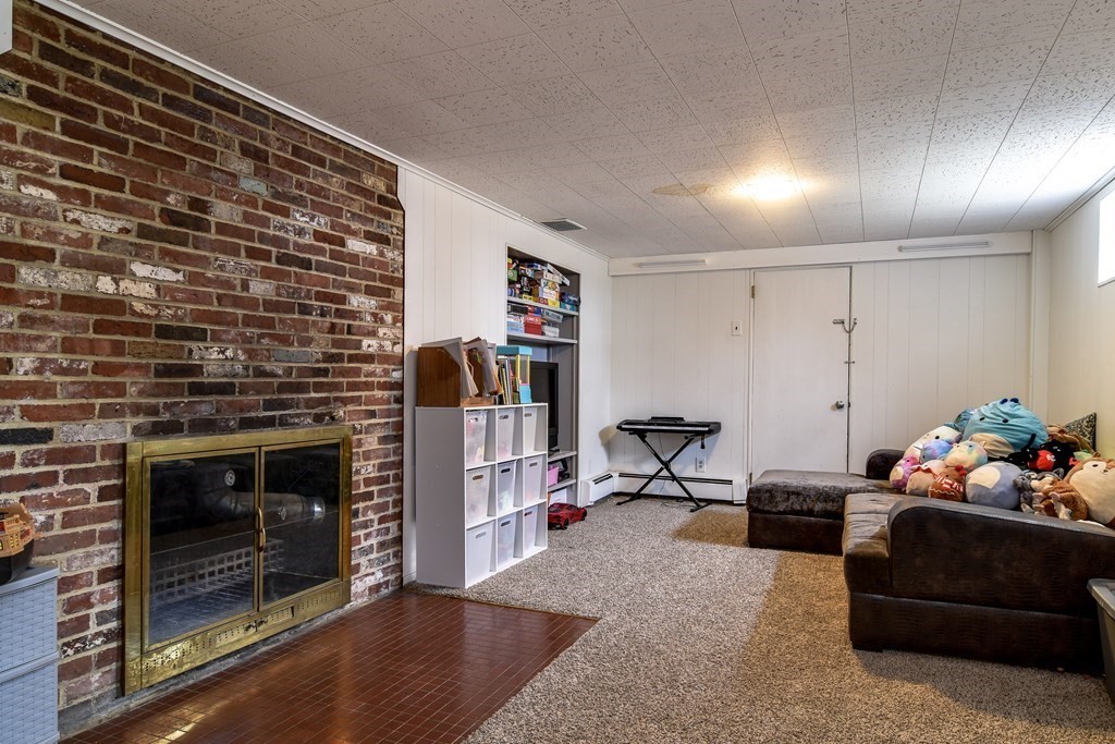 514 Edgell Road Framingham, MA 01701 - Photo 33 of 35 a living room with furniture and a fireplace