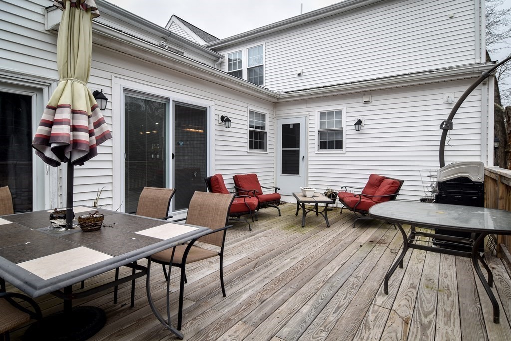 514 Edgell Road Framingham, MA 01701 - Photo 34 of 35 a backyard of a house with table and chairs