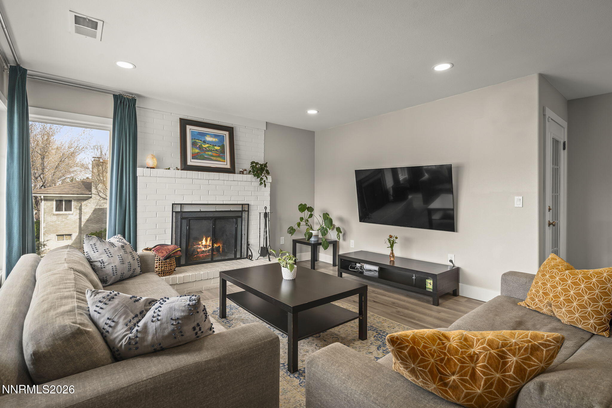 150 Mayberry Drive Reno, NV 89509 - Photo 16 of 40 a living room with furniture and a flat screen tv