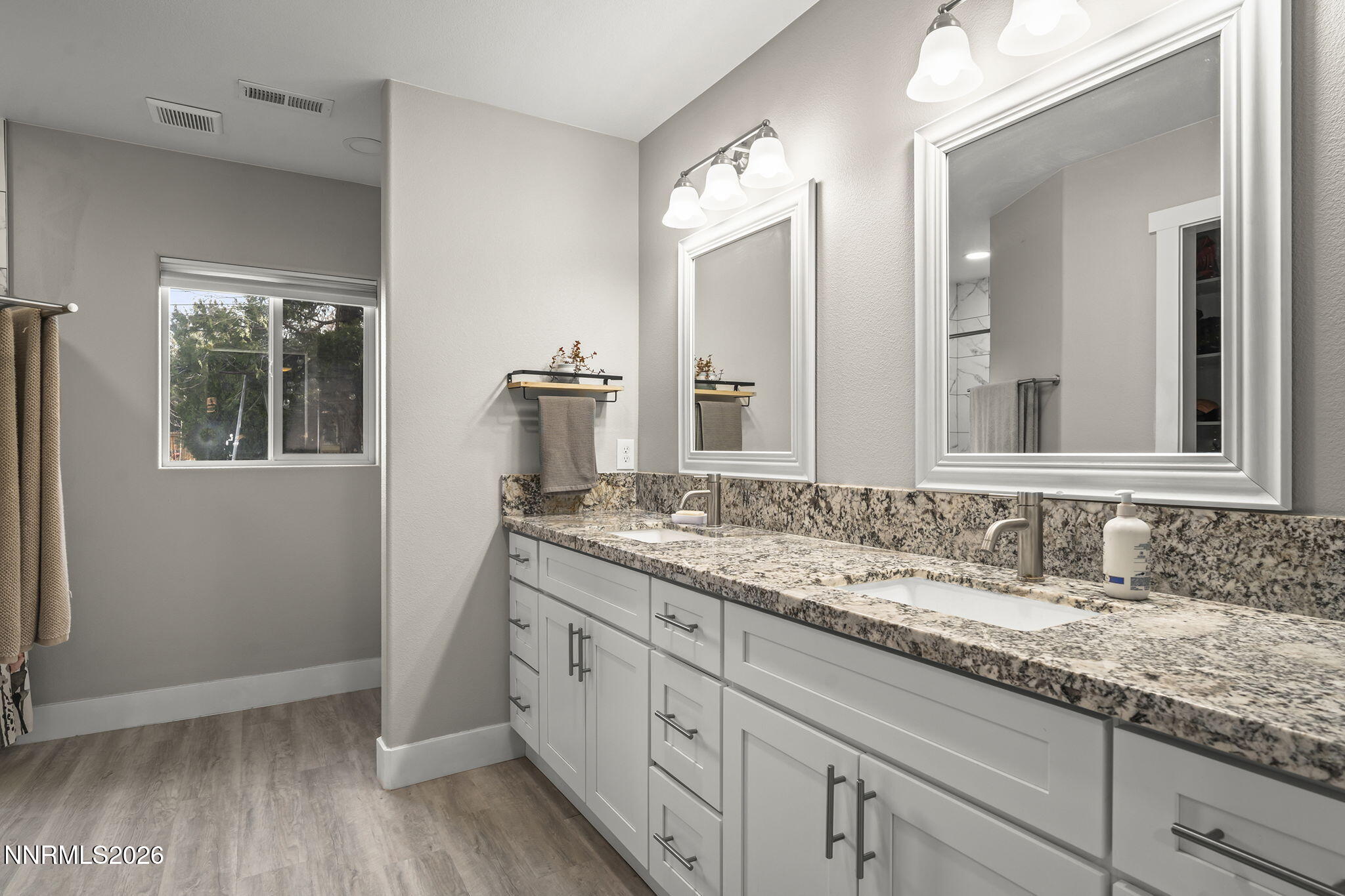 150 Mayberry Drive Reno, NV 89509 - Photo 19 of 40 a bathroom with a granite countertop sink and mirror
