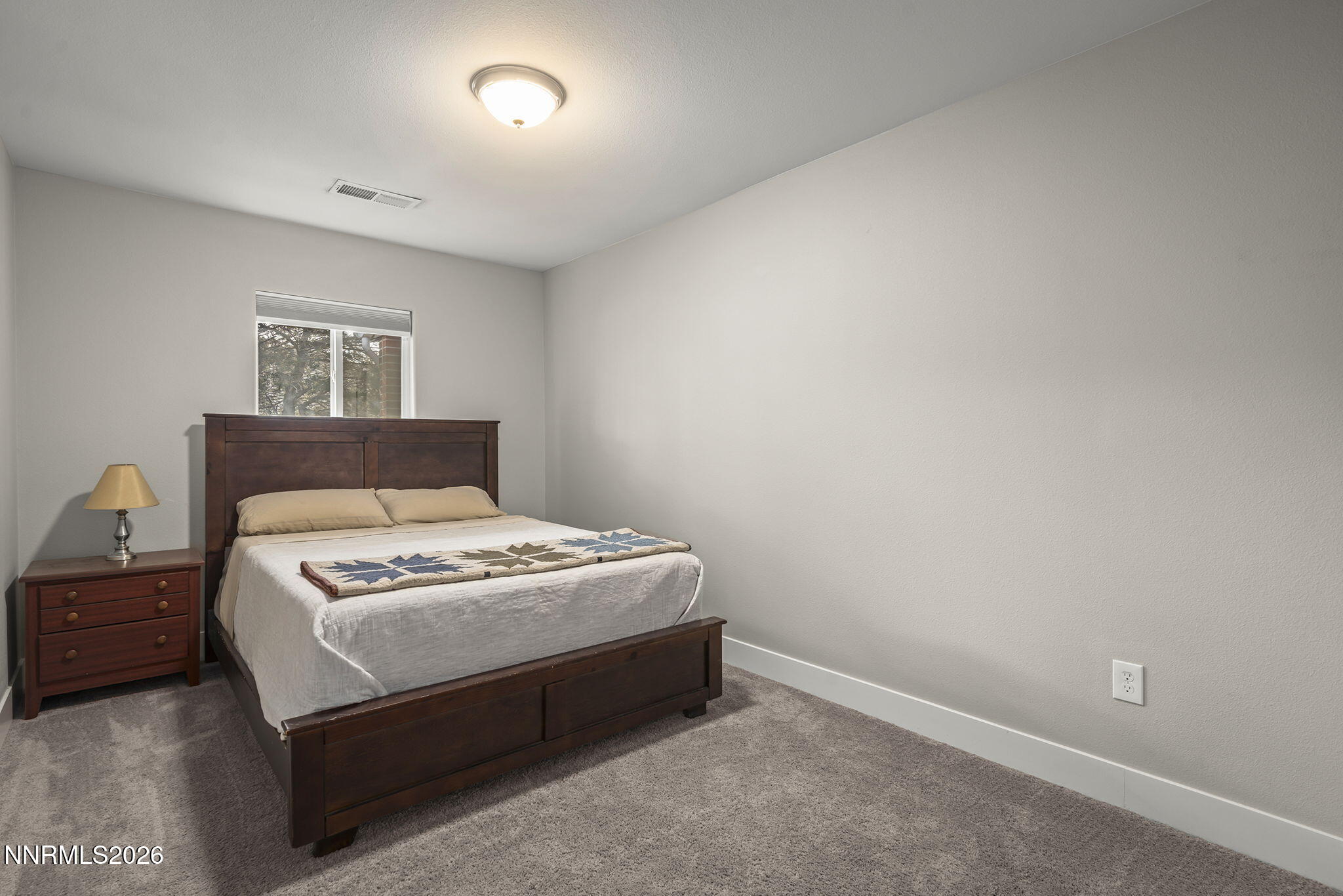 150 Mayberry Drive Reno, NV 89509 - Photo 21 of 40 a bedroom with a bed and a window