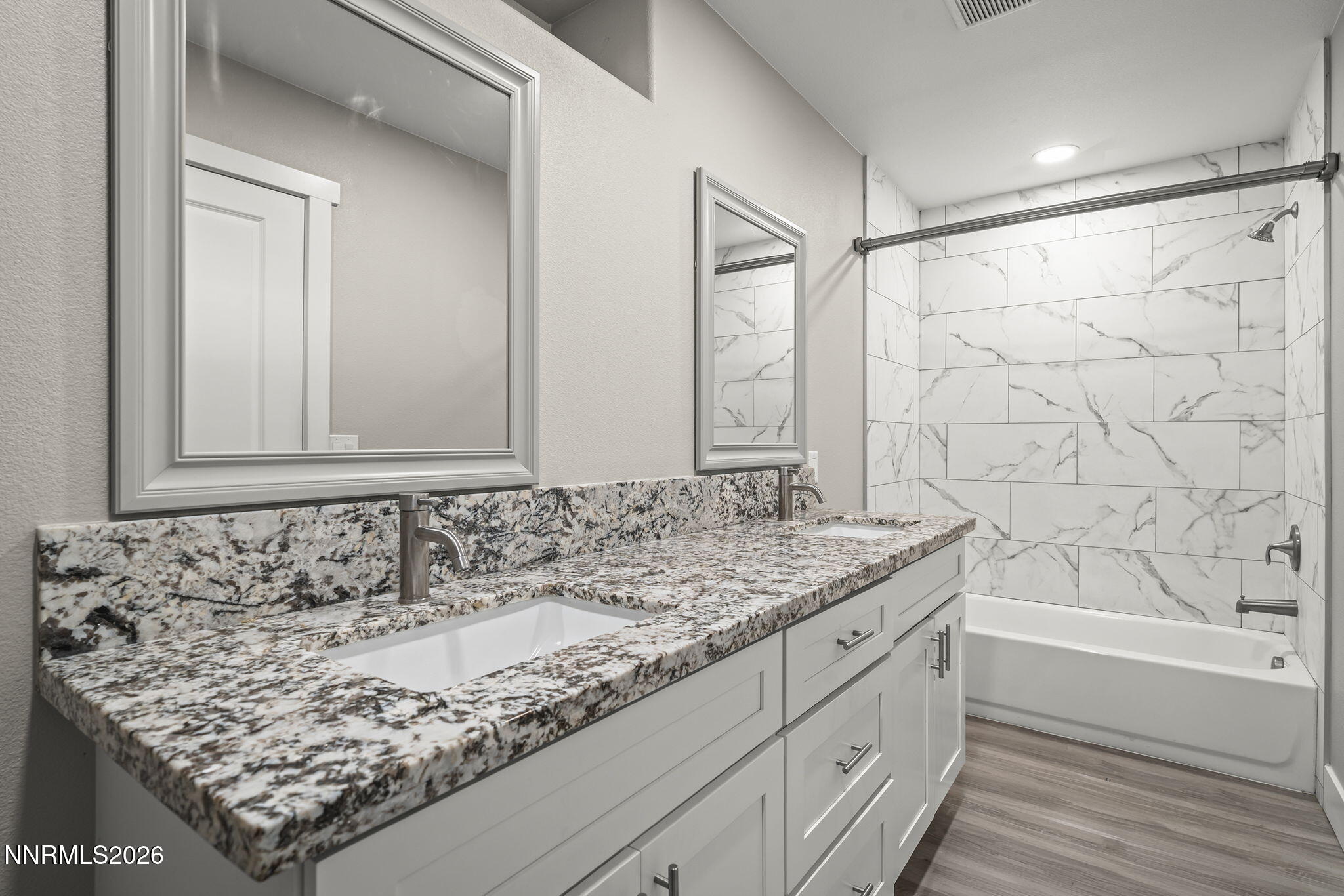 150 Mayberry Drive Reno, NV 89509 - Photo 28 of 40 a bathroom with a granite countertop sink and a bathtub