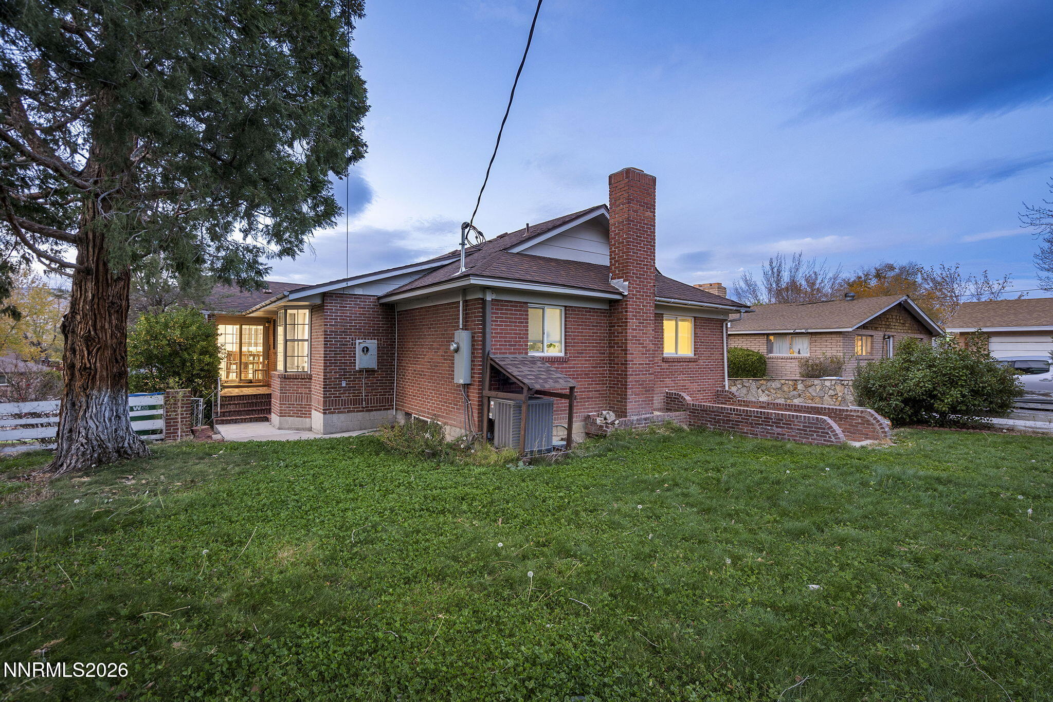 150 Mayberry Drive Reno, NV 89509 - Photo 3 of 40 a front view of a house with a garden
