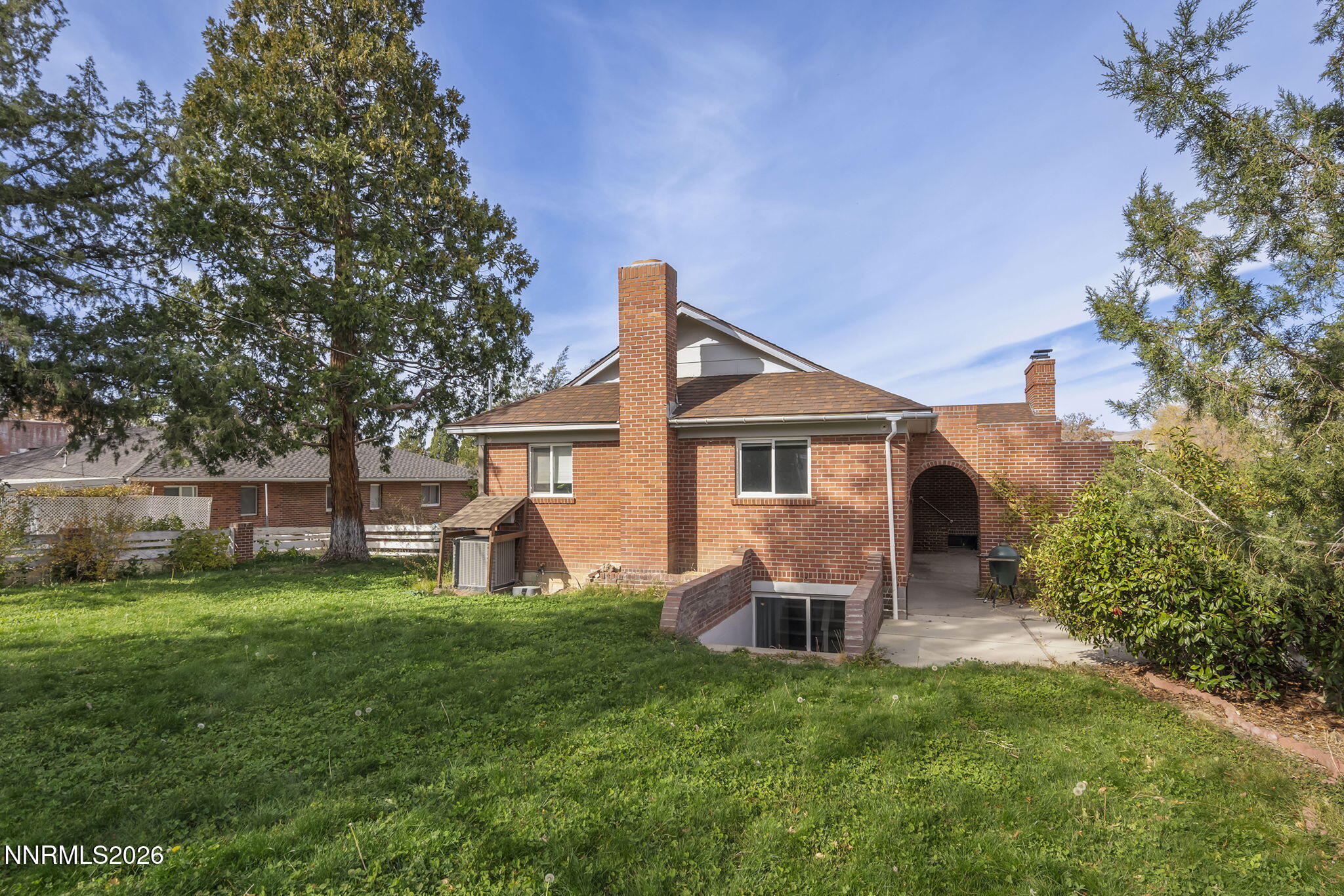 150 Mayberry Drive Reno, NV 89509 - Photo 35 of 40 a front view of a house with a yard porch and sitting area