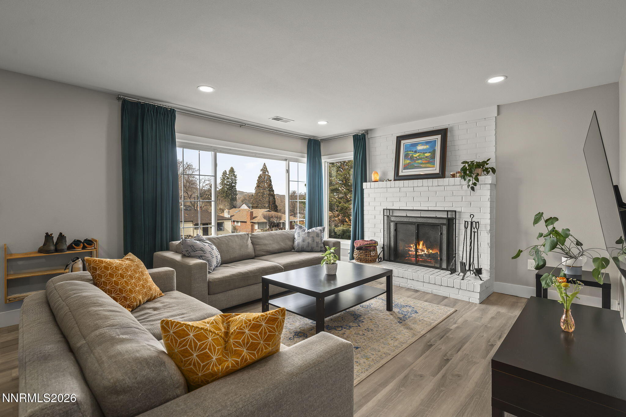 150 Mayberry Drive Reno, NV 89509 - Photo 8 of 40 a living room with furniture and a fireplace