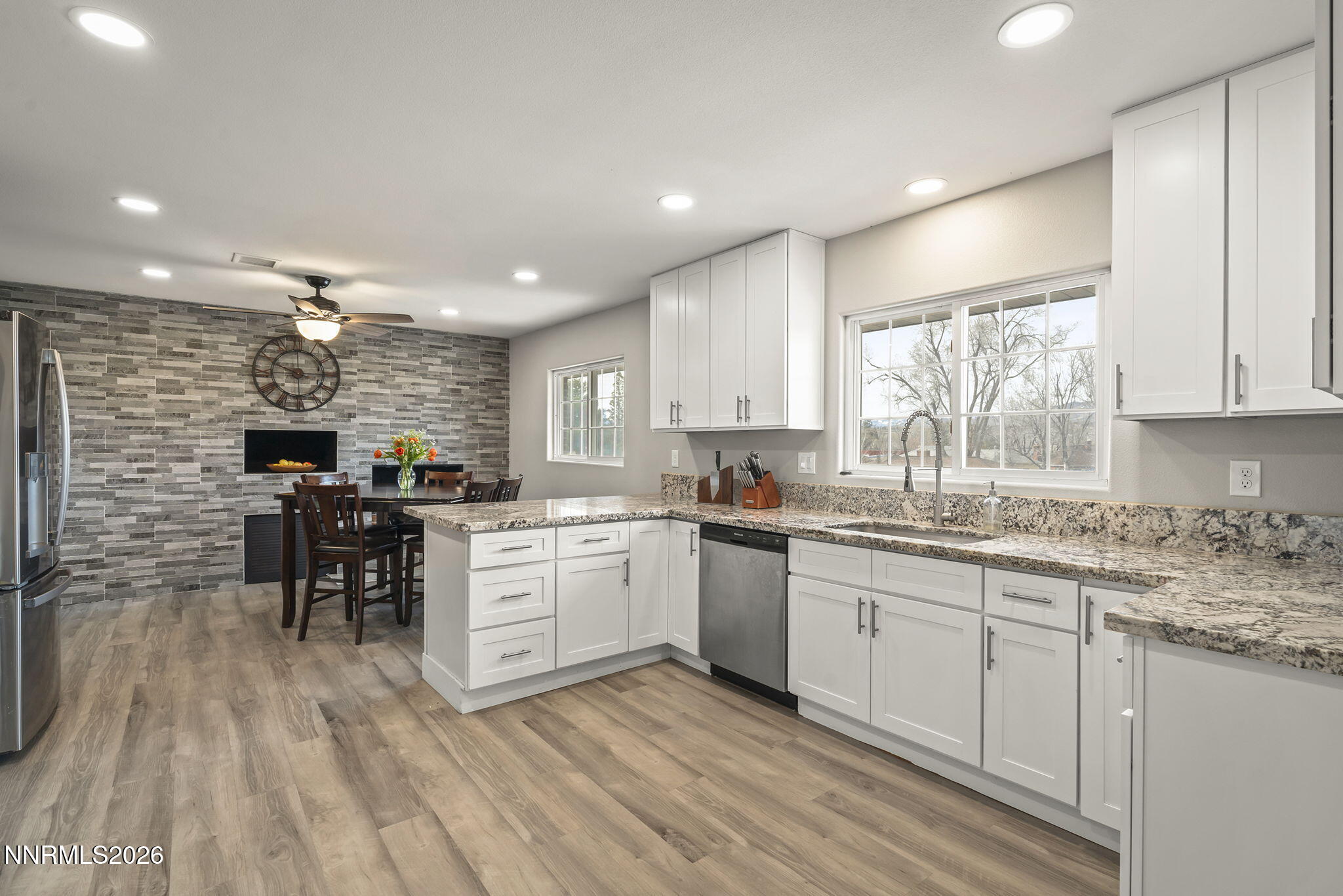 150 Mayberry Drive Reno, NV 89509 - Photo 10 of 40 a kitchen with granite countertop cabinets a sink and appliances