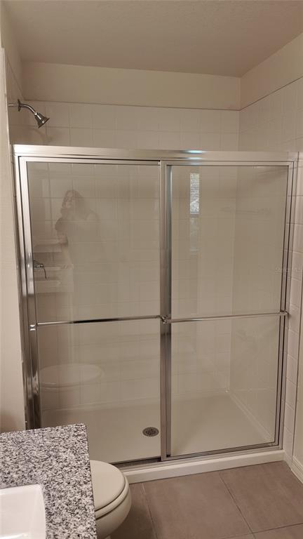 2798 Raindrop Run Street Clermont, FL 34714 - Photo 13 of 18 a bathroom with a shower