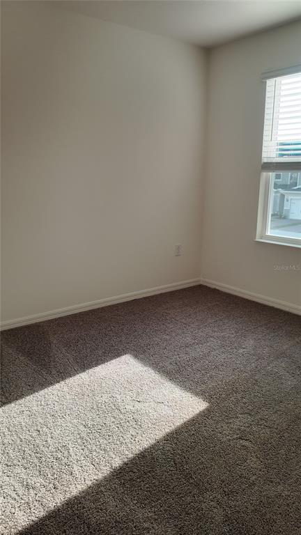 2798 Raindrop Run Street Clermont, FL 34714 - Photo 16 of 18 an empty room with windows