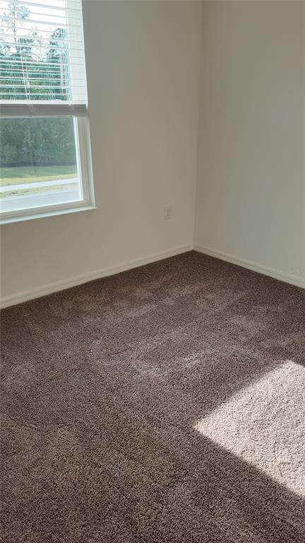 2798 Raindrop Run Street Clermont, FL 34714 - Photo 17 of 18 a view of a window in an empty room