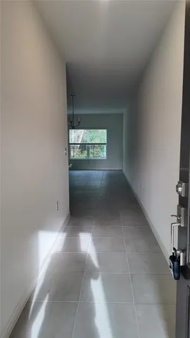 a view of an empty room and a window